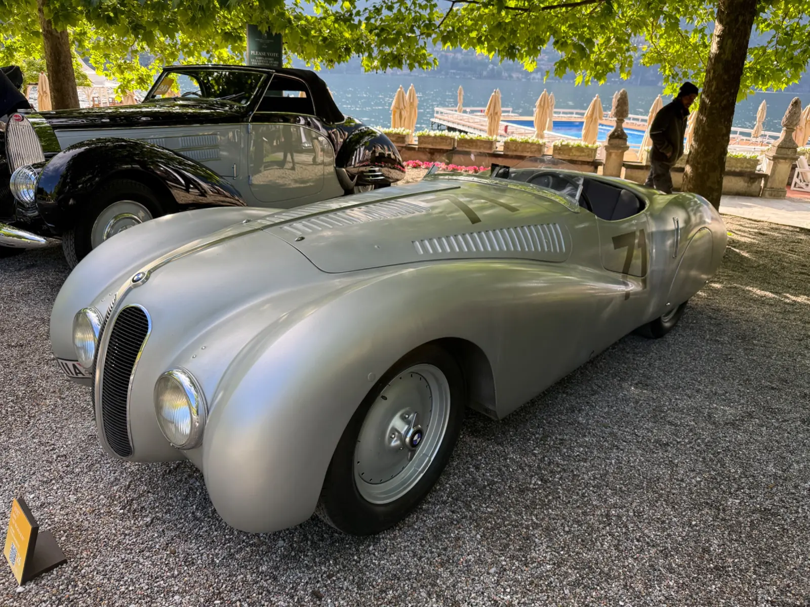 Historic sports cars presented beside Lake Como